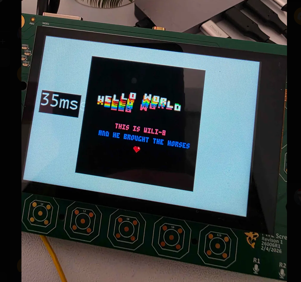 FREE-WILi 2 board running a Hello World demo on its display